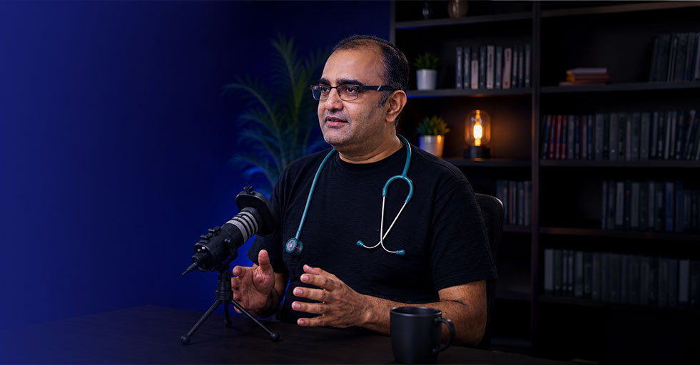 Dr. Chirag Jain recording a medical podcast on cancer anxiety, oncology, and the nervous system